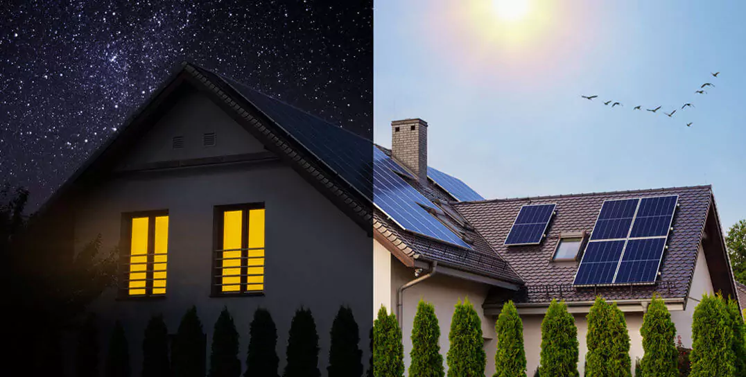 a house PV panels in the daytime and at night